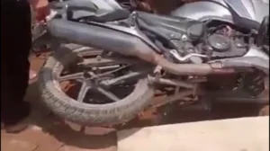 అదుపు తప్పి డ్రైనేజీ లోపడిన బైక్